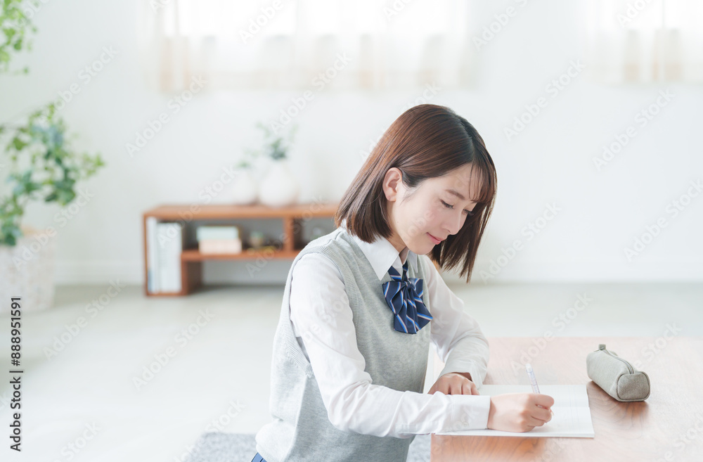 家で受験勉強する女子高校生
