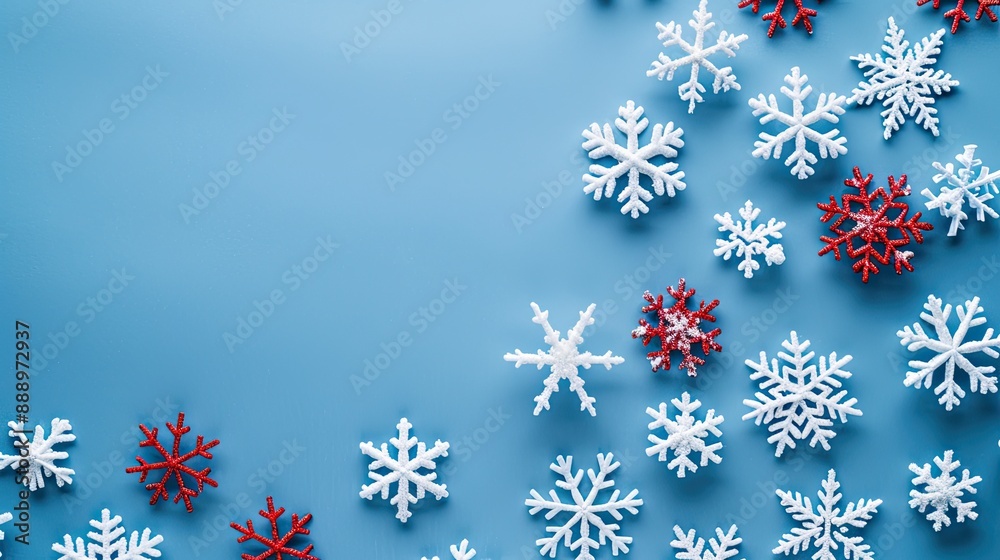 White and red snowflakes on a blue background Christmas banner Merry Christmas and Happy New Year concept top view copy space White and red snowflakes on a blue background Christmas banner Merry Christmas and Happy New Year concept top view copy space