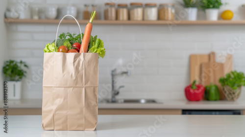 Paper bag full of healthy food on the kitchen table and copy space