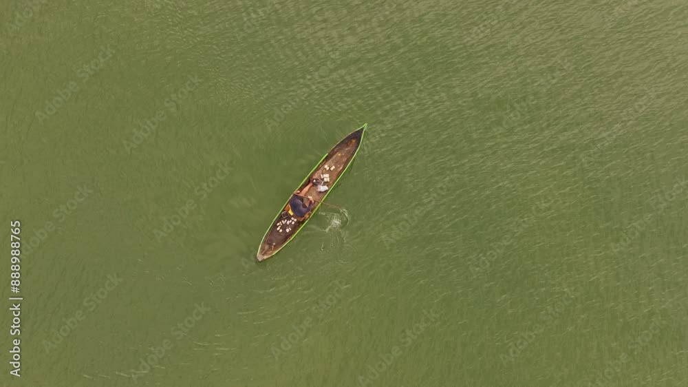 Aerial view of tranquil fishing scene on green water lake at sunrise, Rio Dulce, Izabal, Guatemala. Aerial view of tranquil fishing scene on green water lake at sunrise, Rio Dulce, Izabal, Guatemala.