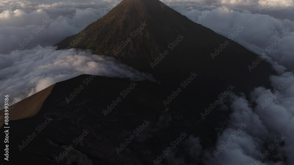 Aerial view of erupting volcano with smoke and explosion, Fuego, Chimaltenango, Guatemala.