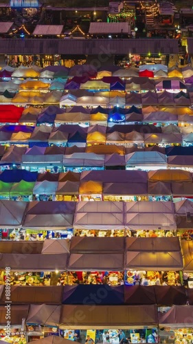 Dusk to night timelapse of Asian night market, Bangkok, Thailand. 