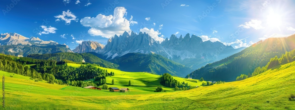 Fototapeta premium Beautiful green meadow with mountains in the background panorama landscape nature scenery with blue sky.