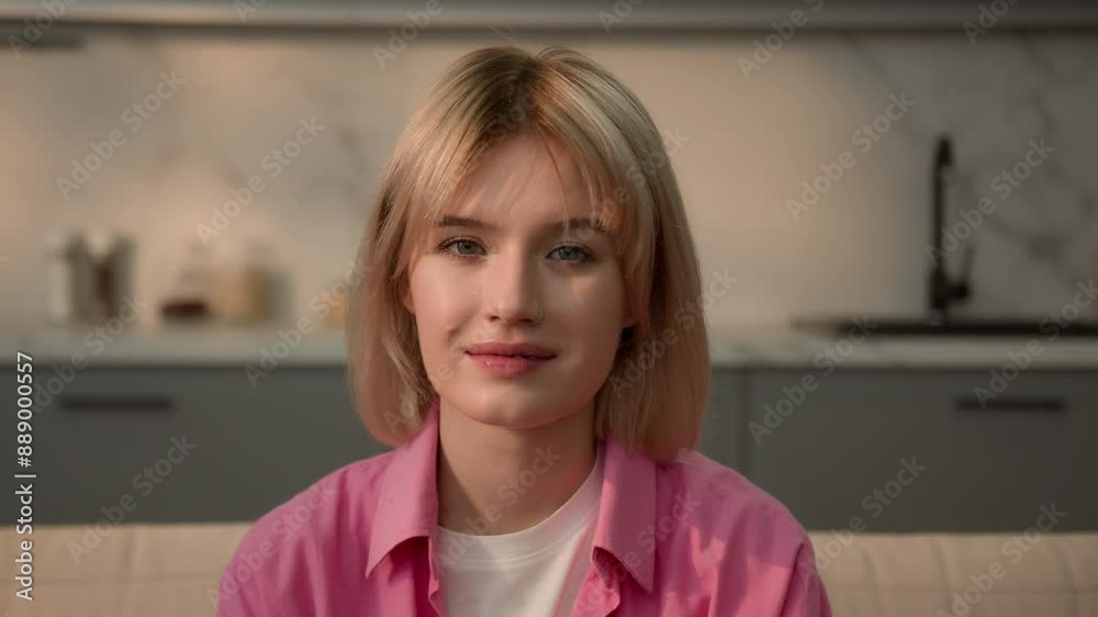 Close up portrait calm smiling peaceful Caucasian teen student girl woman lady female homeowner renter housekeeper at home apartment indoors looking at camera relaxing at couch insurance mortgage loan