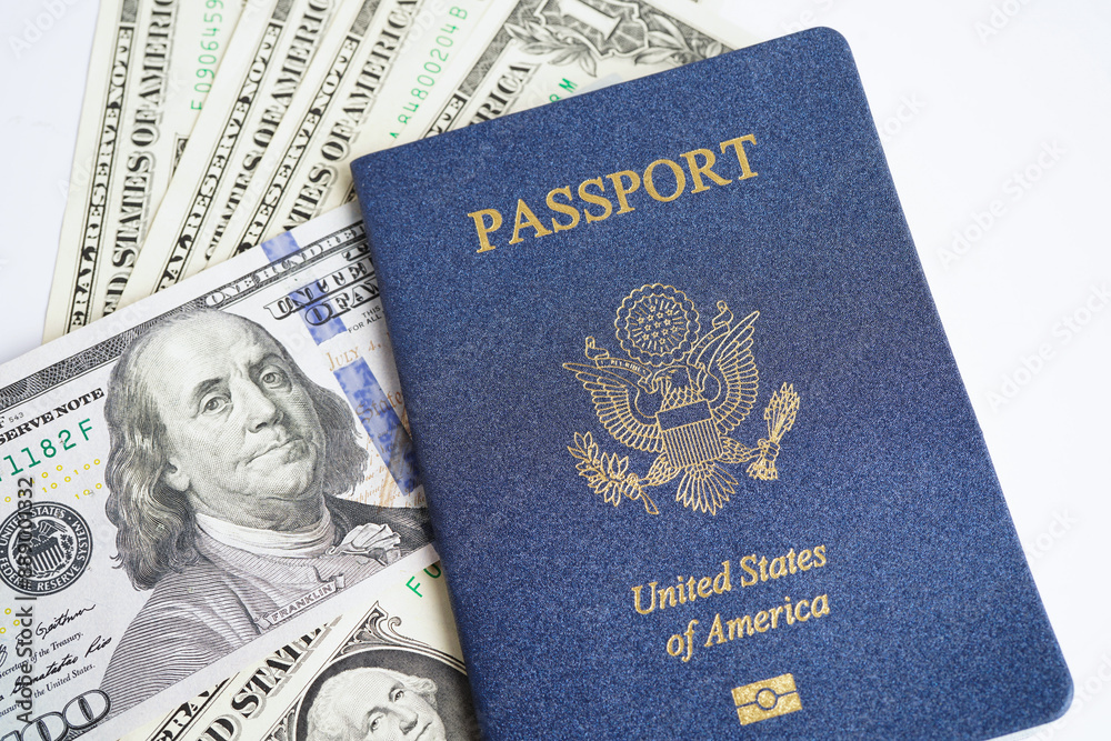 Fototapeta premium US passport with USA dollar money, American citizen in United States of America.