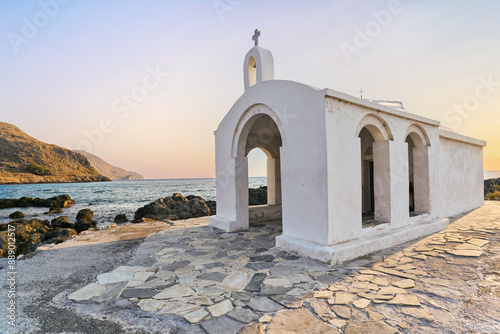 Chapel in the sea at Georgioupolis - Greece Crete. Sunrise on mediterranean sea. 