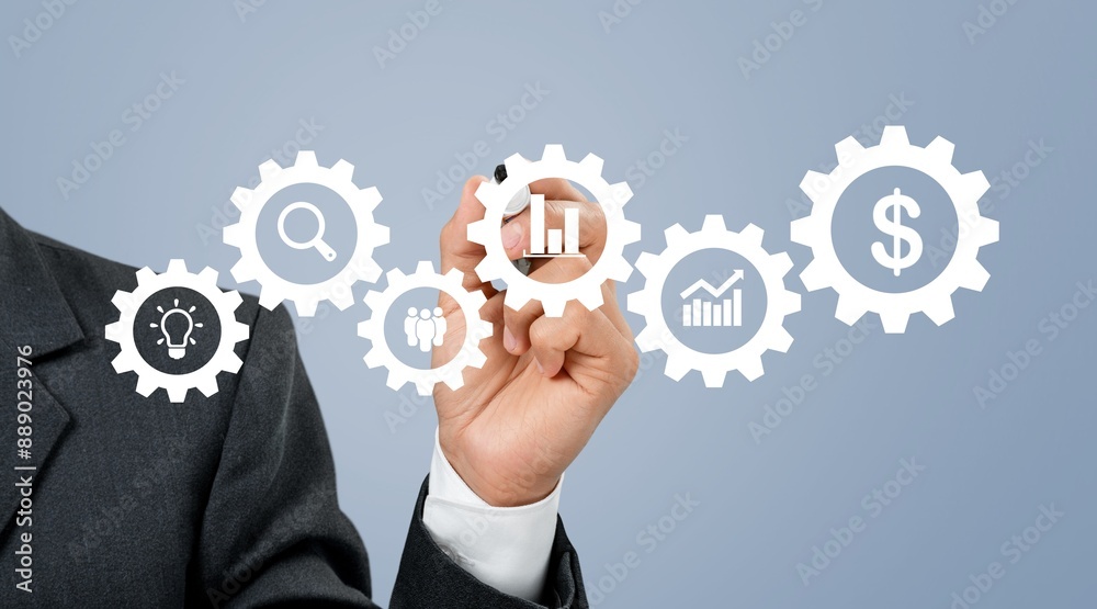 Businessman pointing on a virtual screen with usiness icons Businessman pointing on a virtual screen with usiness icons