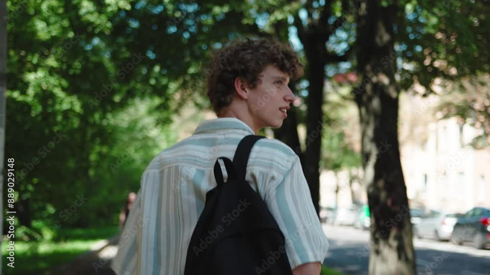 Man tourist walk on street in park look around sightseeing, male traveler teenager looking at urban buildings enjoying journey spending vacations travelling walking outdoors travel concept Man tourist walk on street in park look around sightseeing, male traveler teenager looking at urban buildings enjoying journey spending vacations travelling walking outdoors travel concept