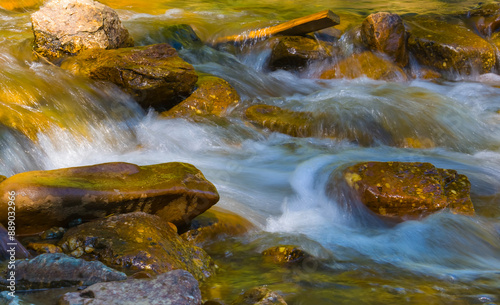 small mountain brook rushing over a stones