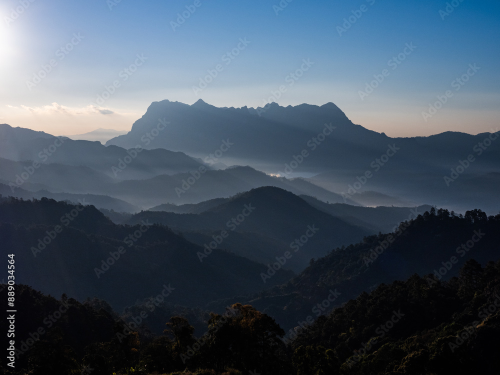 Fototapeta premium Doi Luang Chiang Dao mountain at dawn with blue tone sunrise sky. Chiang Mai - Thailand
