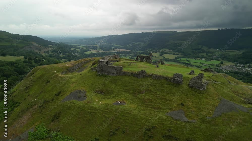 Dinas Brân castle, legendary home of the Holy Grail, Wales - aerial clockwise rotate from close on a moody summer’s afternoon Dinas Brân castle, legendary home of the Holy Grail, Wales - aerial clockwise rotate from close on a moody summer’s afternoon