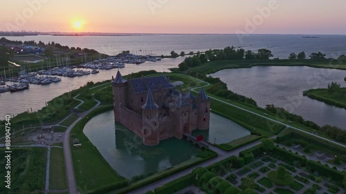 Aerial view of medieval castle with lake and sunset, Muiden, North Holland, Netherlands. photo