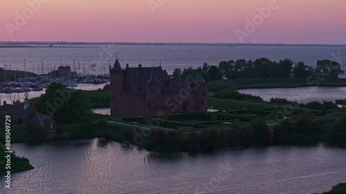 Aerial view of Muiderslot castle at sunset by the lake, Muiden, Netherlands. photo