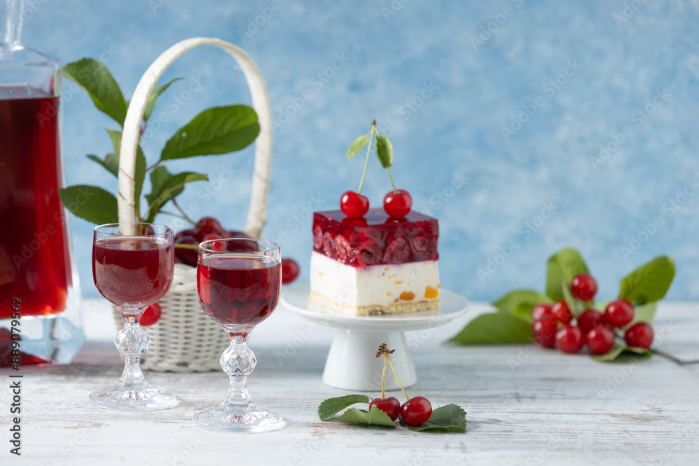 Cherry liqueur in a carafe and glasses Cherry liqueur in a carafe and glasses