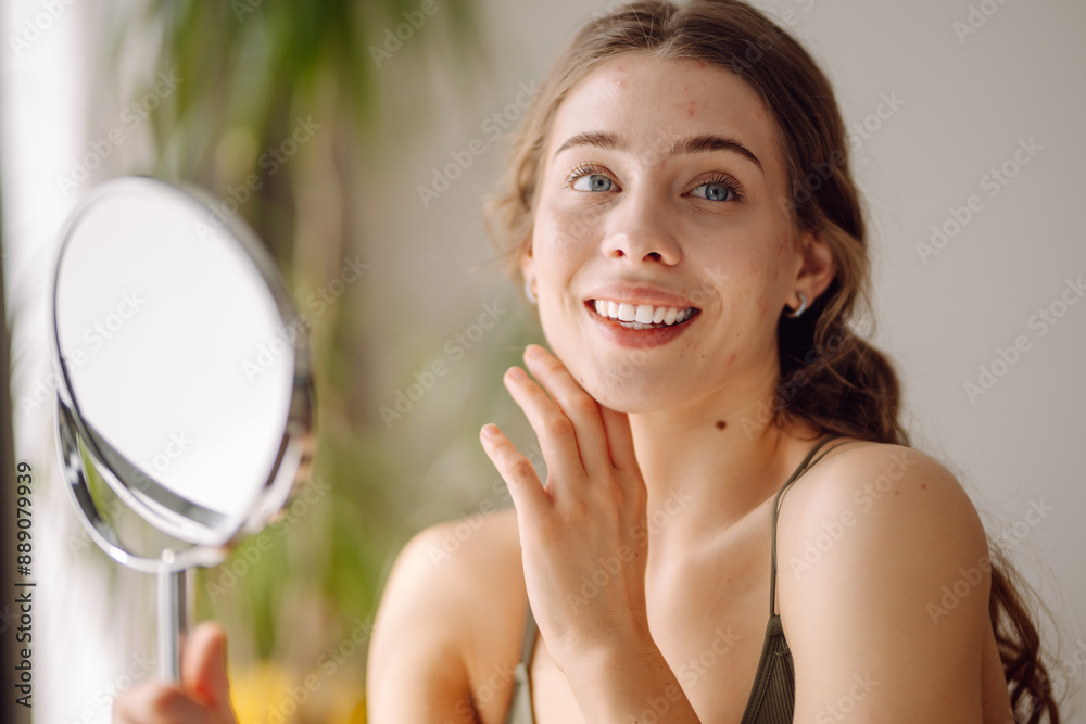 Portrait of a young woman without makeup with Acne skin. Skin problems, first mimic wrinkles or acne pimples, annoyed by blackheads. Portrait of a young woman without makeup with Acne skin. Skin problems, first mimic wrinkles or acne pimples, annoyed by blackheads.