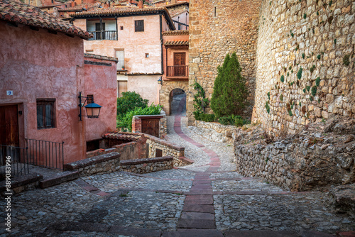 Fototapeta Naklejka Na Ścianę i Meble -  Small square where the Portal del Agua is located, which is one of the doors that gives access to the defensive enclosure of the medieval walls of Albarracín, Teruel, Aragón, Spain