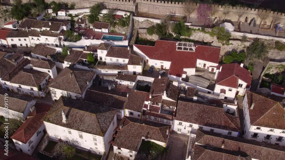 Aerial view of traditional houses and castle in charming Obidos, Leiria, Portugal. Aerial view of traditional houses and castle in charming Obidos, Leiria, Portugal.