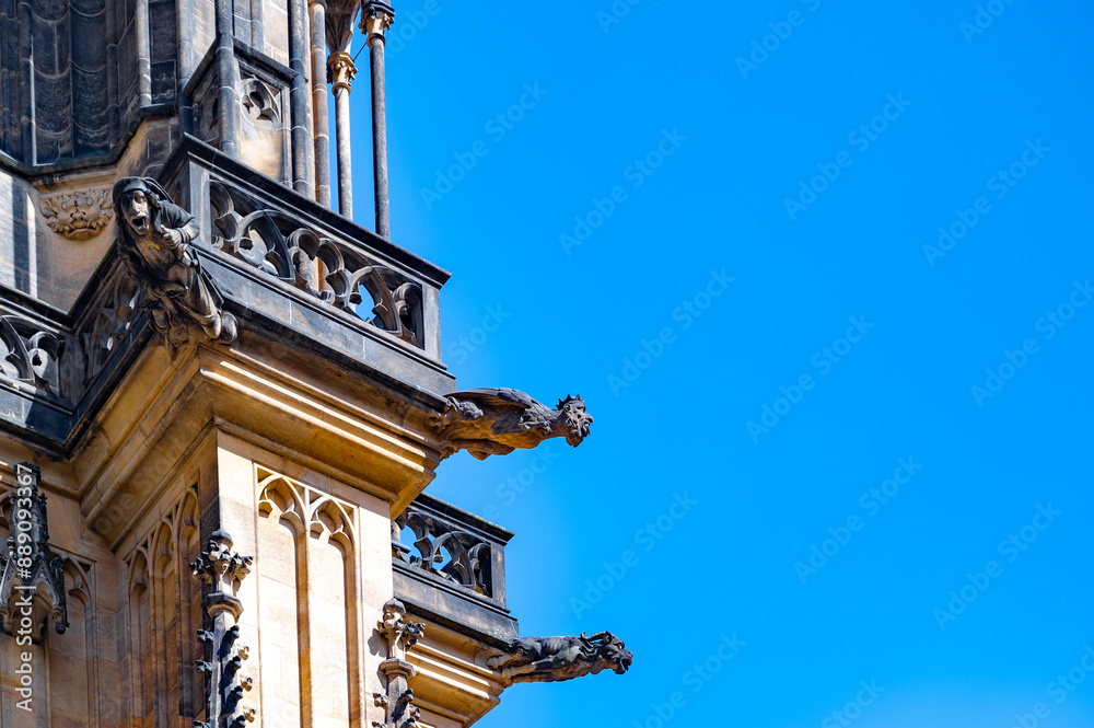 Gargoyle at St Vitus Cathedral, Prague, Czech Republic. They guard and protect the church from evil and harmful spirits, originally designed as waterspouts. Gargoyle at St Vitus Cathedral, Prague, Czech Republic. They guard and protect the church from evil and harmful spirits, originally designed as waterspouts.