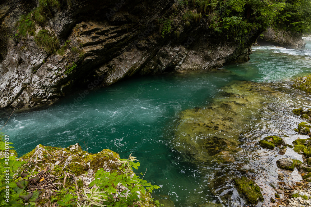 Vintgar Gorges Park a few km from Lake Bled, Slovenia. Wooden walkways accompany the path above the river rapids and waterfalls. River hits rocks and creates fog.Adventure family holidays. Freshness. Vintgar Gorges Park a few km from Lake Bled, Slovenia. Wooden walkways accompany the path above the river rapids and waterfalls. River hits rocks and creates fog.Adventure family holidays. Freshness.