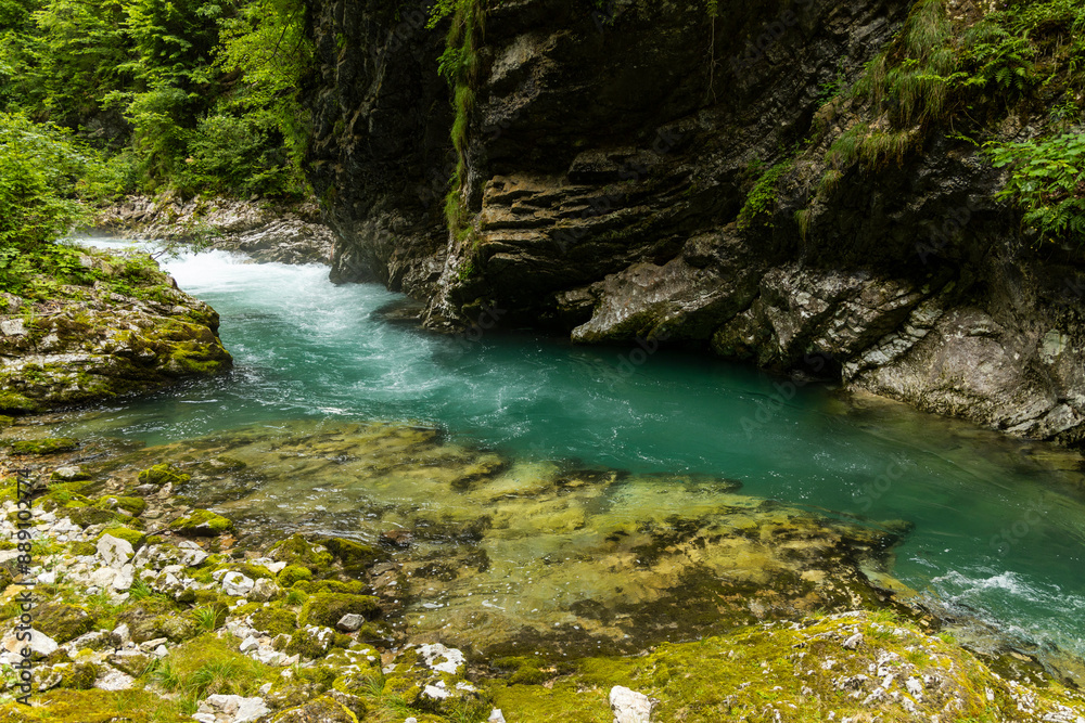 Vintgar Gorges Park a few km from Lake Bled, Slovenia. Wooden walkways accompany the path above the river rapids and waterfalls. River hits rocks and creates fog.Adventure family holidays. Freshness. Vintgar Gorges Park a few km from Lake Bled, Slovenia. Wooden walkways accompany the path above the river rapids and waterfalls. River hits rocks and creates fog.Adventure family holidays. Freshness.
