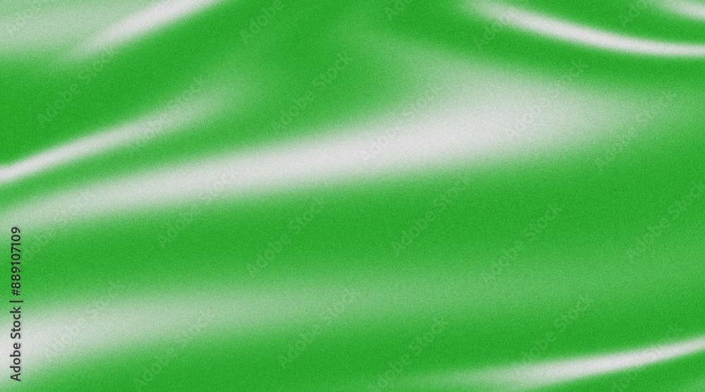 Green smooth flowing abstract silk textile background wallpaper with copy space