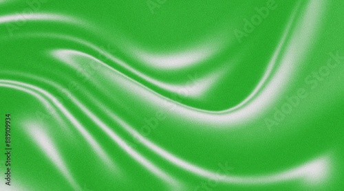 Green smooth flowing abstract silk textile background wallpaper with copy space