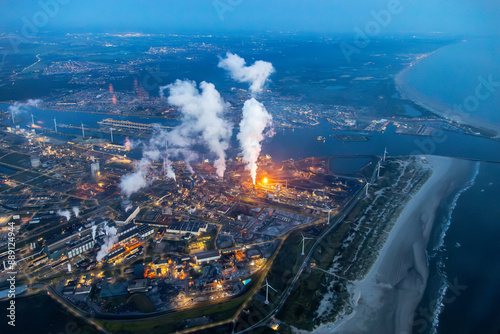 Bild auf Leinwand Aerial image of steel plant, factory, refinery with massive flame from chimney