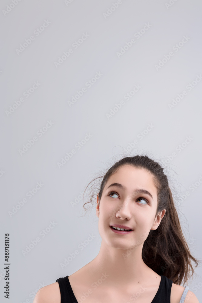 Young woman thinking and looking up with hope Young woman thinking and looking up with hope