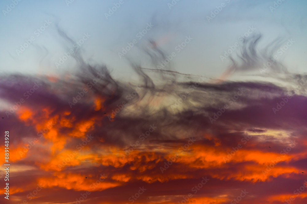 Burning clouds in the sky at sunset Burning clouds in the sky at sunset