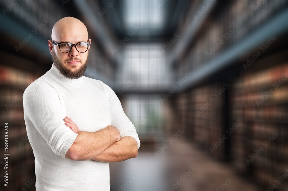 Happy confident business man standing in office Happy confident business man standing in office