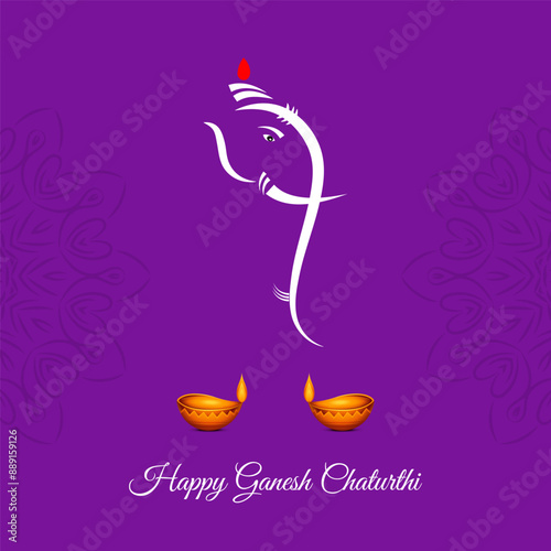 A purple background with a central silhouette of Ganesha depicted in profile with a large head and pot belly two lit candles are positioned on either side of the silhouette