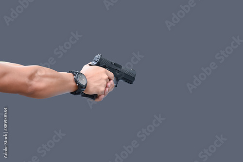 Isolated 9mm pistol gun holding in right hand of gun shooter with clipping paths.