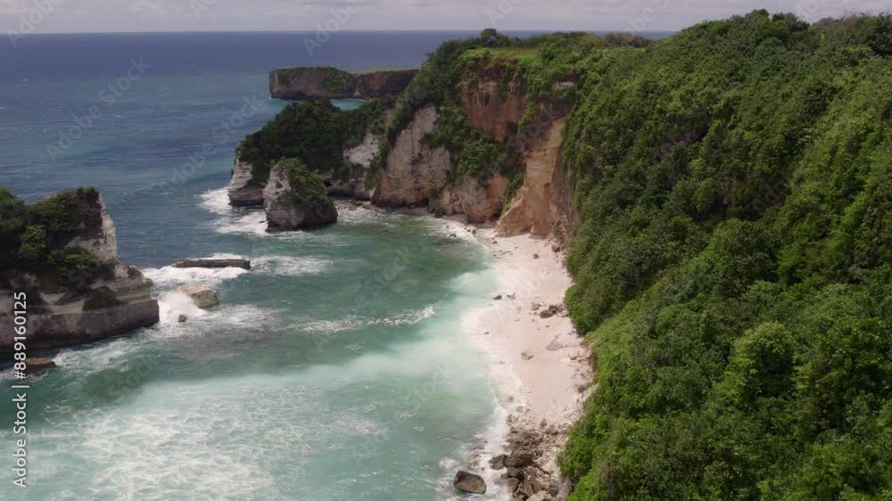 Aerial view of rocky beach and cliffs with Indian Ocean waves, Watu Malandong, Sumba Island, Indonesia. Aerial view of rocky beach and cliffs with Indian Ocean waves, Watu Malandong, Sumba Island, Indonesia.