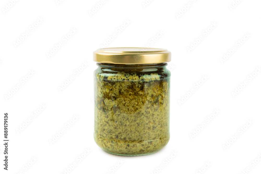 Pesto. Italian basil pesto sauce isolated on white background. Ingredient for pesto sauce: fresh basil, pine nuts, Parmesan cheese and olive oil. Space for text.Copy space. Pesto. Italian basil pesto sauce isolated on white background. Ingredient for pesto sauce: fresh basil, pine nuts, Parmesan cheese and olive oil. Space for text.Copy space.