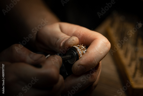 craftsman making diamond ring. hand made jewelery. Put diamond gem ring. diamond ring production craftman workshop. solitaire ring making