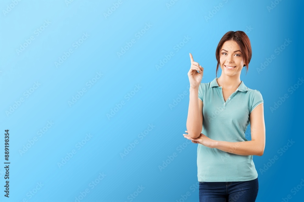 Smiling pretty young woman posing on color background Smiling pretty young woman posing on color background