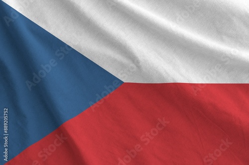 Czech flag depicted on folded wavy fabric of old cloth close up