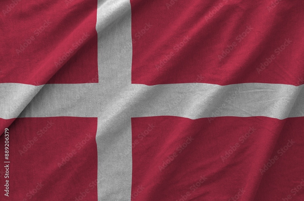 Denmark flag depicted on folded wavy fabric of old cloth close up Denmark flag depicted on folded wavy fabric of old cloth close up