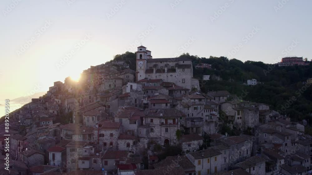 Aerial view of Santo Stefano church at sunrise with fog over hill town, Artena, Italy. Aerial view of Santo Stefano church at sunrise with fog over hill town, Artena, Italy.