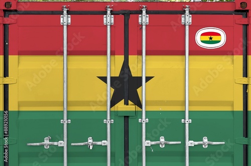 Ghana flag depicted on metal doors of shipping cargo container outdoors in docks area close up photo