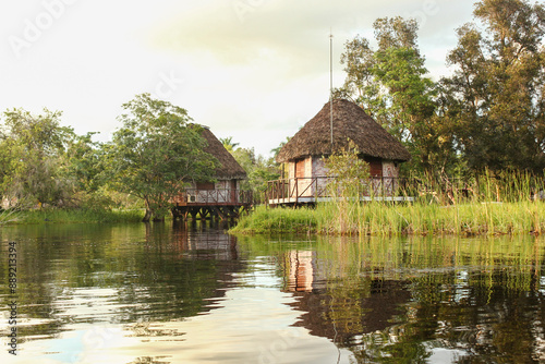 Cuba - Laguna del Tesoro - Cuba - Laguna del Tesoro - Lakeside Huts at Sunset photo