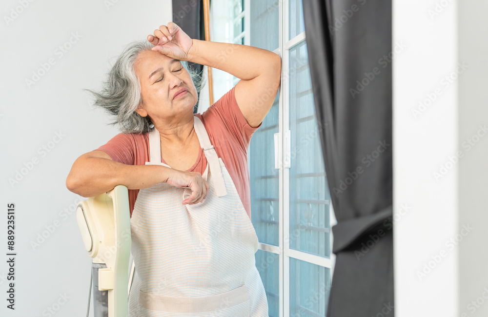 Tired senior woman housemaid cleaning a room, Woman vacuuming the floor in bedroom Tired senior woman housemaid cleaning a room, Woman vacuuming the floor in bedroom