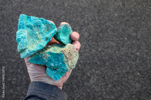 Blue green copper (Cu) oxide ore, held in hand. Mining. photo