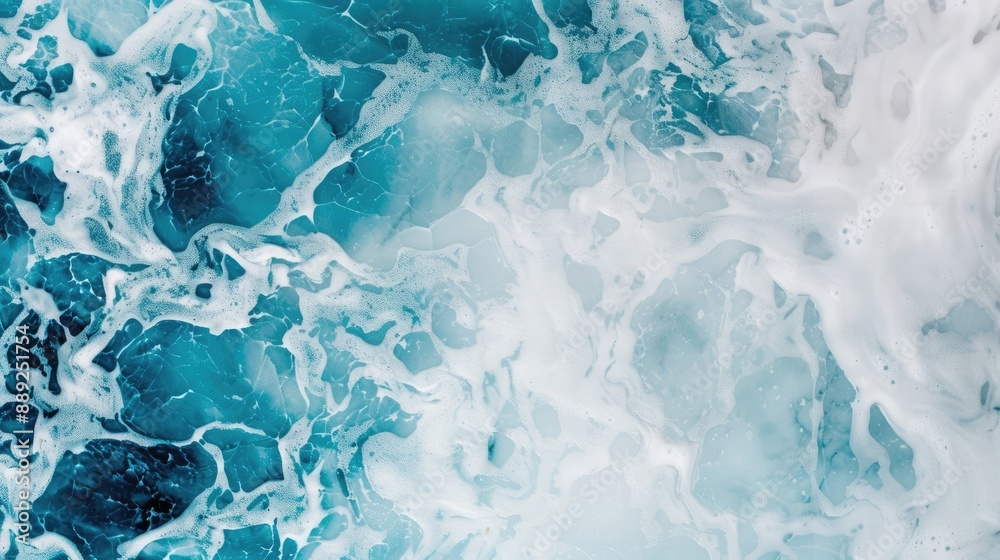 Obraz premium Dynamic ocean waves and splashing water, capturing the intense energy and movement of the sea with vibrant blue and white colors.