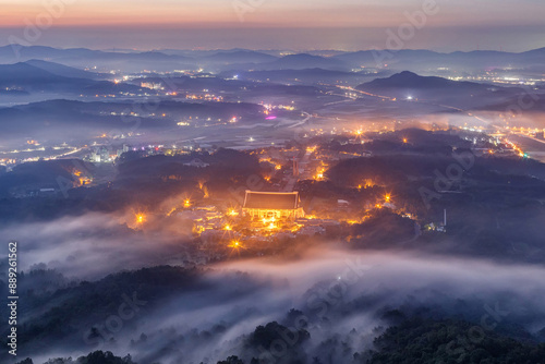 Summer and dawn view of road and Independence Hall of Korea with sea of clouds and light seen from Heukseongsan Mountain near Cheonan-si, South Korea
 photo