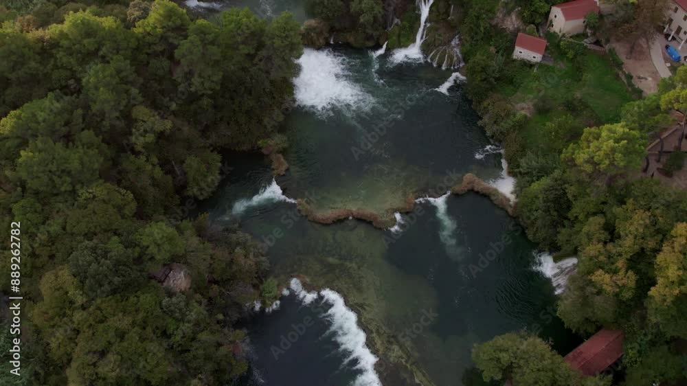Aerial view of picturesque waterfall and lush forest in Krka National Park, Croatia. Aerial view of picturesque waterfall and lush forest in Krka National Park, Croatia.