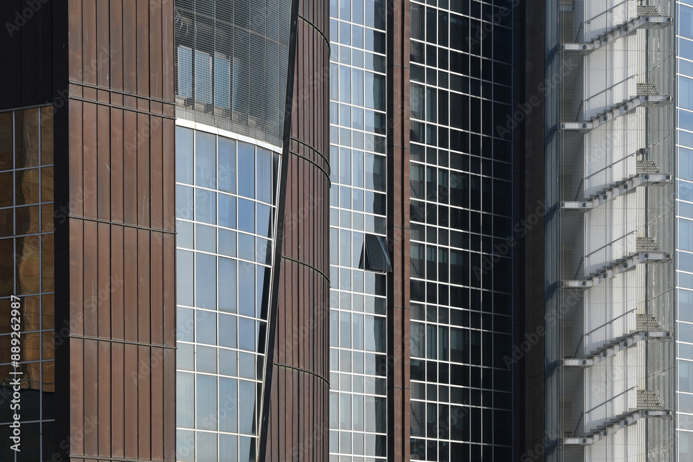 Architecture of a modern office building, construction background. Facade glass windows of a corporate center. Modern commercial buildings exterior. Architecture of a modern office building, construction background. Facade glass windows of a corporate center. Modern commercial buildings exterior.