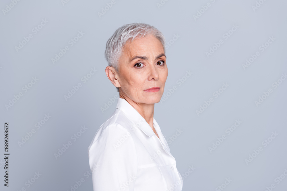 Profile side photo of confident serious qualified doctor woman surgeon wear white robe isolated on grey color background Profile side photo of confident serious qualified doctor woman surgeon wear white robe isolated on grey color background