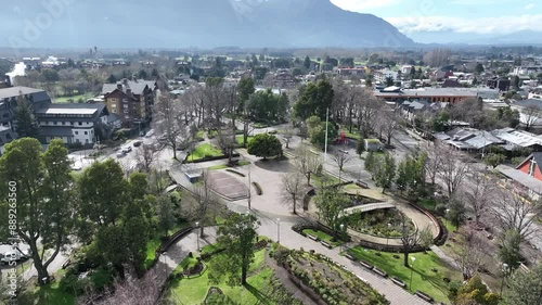 Plaza De Armas At Pucon Araucania Chile. Aerial View Of A Bustling City With High-Rise Buildings And Traffic. Snowflakes Lake Patagonia Landscape Snow Capped. Patagonia Landscape. Pucon Araucania. photo
