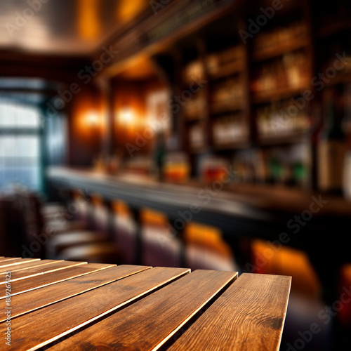 Empty brown wooden table top with space for food and drink and products in a moody dark bar. 